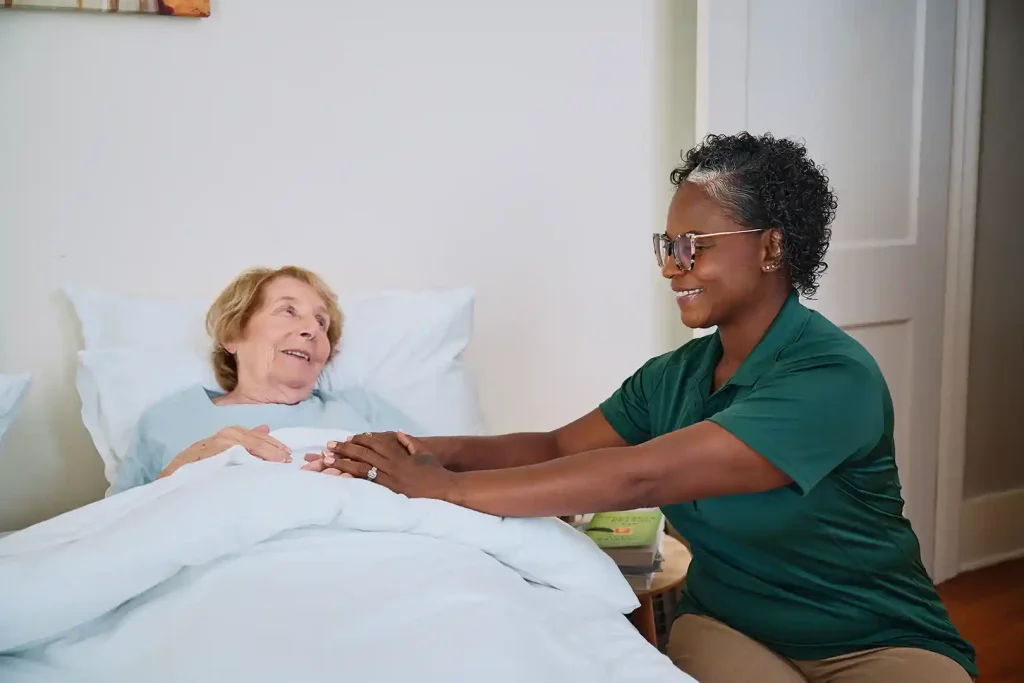 Care Pro providing nighttime reassurance and bedtime support to senior woman in Toronto home