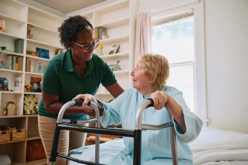 Care Pro assisting senior woman with walker for safe mobility at home in Toronto