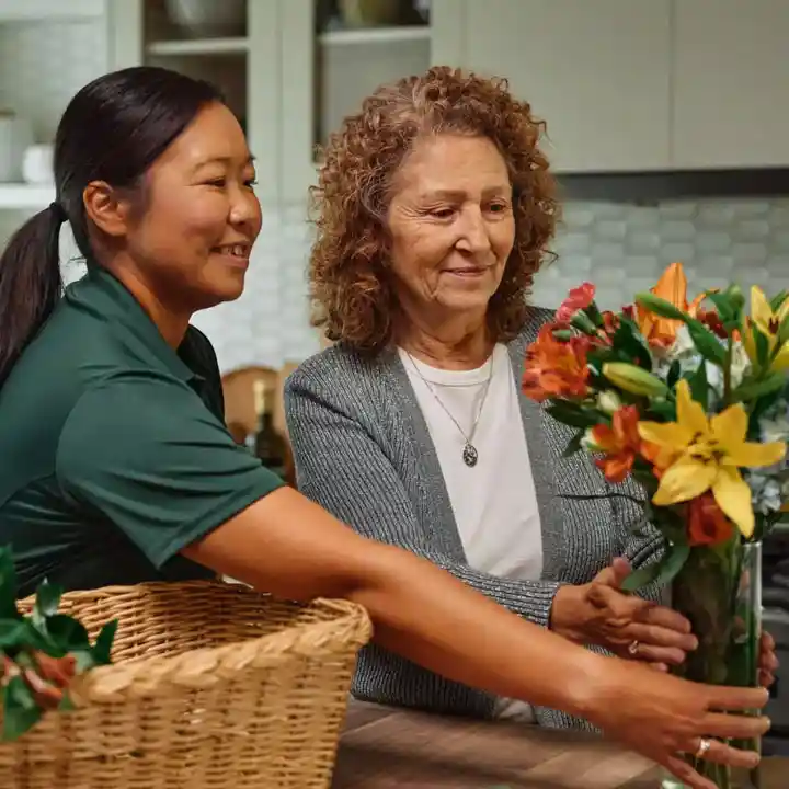 Care Pro helping senior with flowers