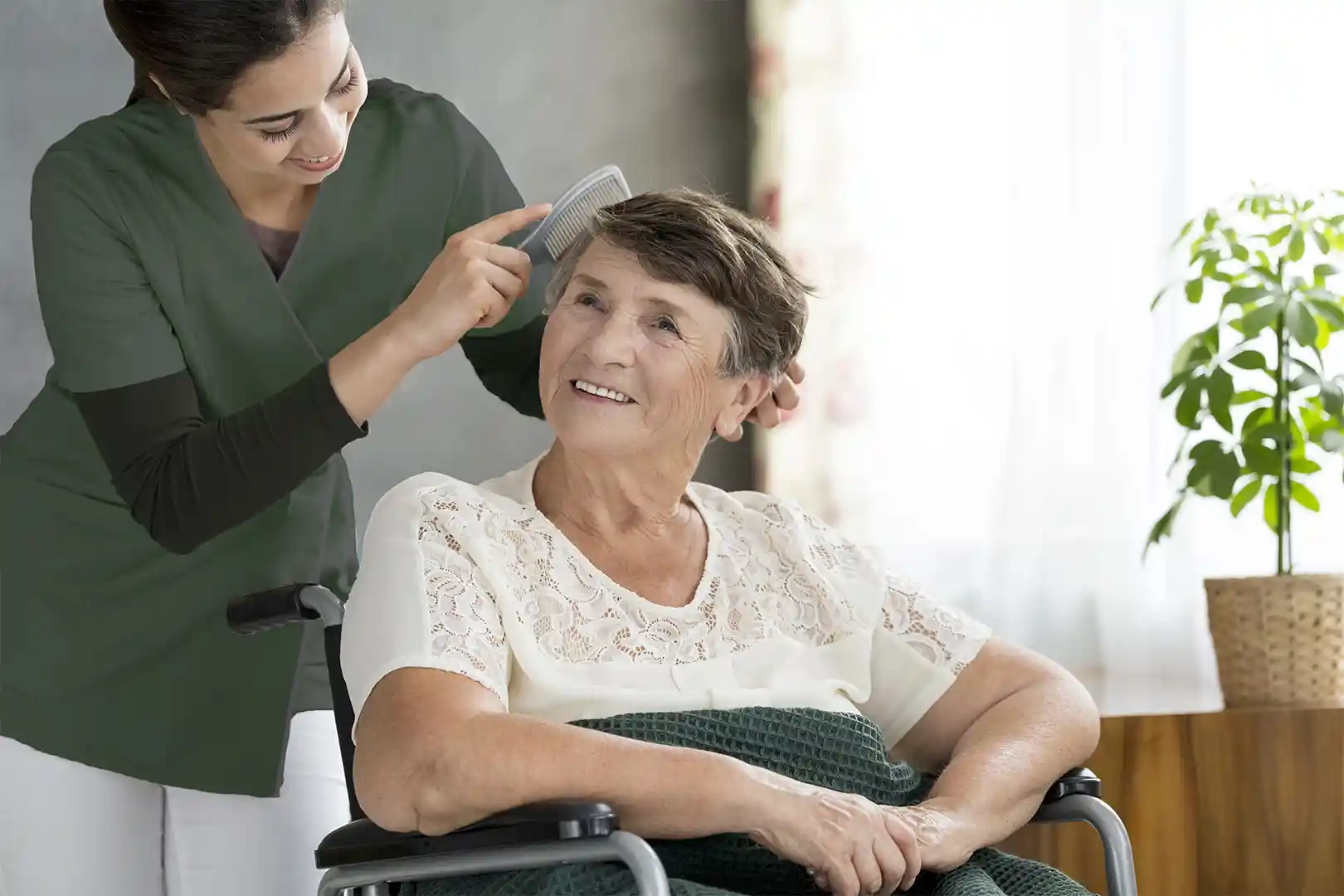 Care Pro providing dignified hair care and grooming assistance to senior woman in Toronto home